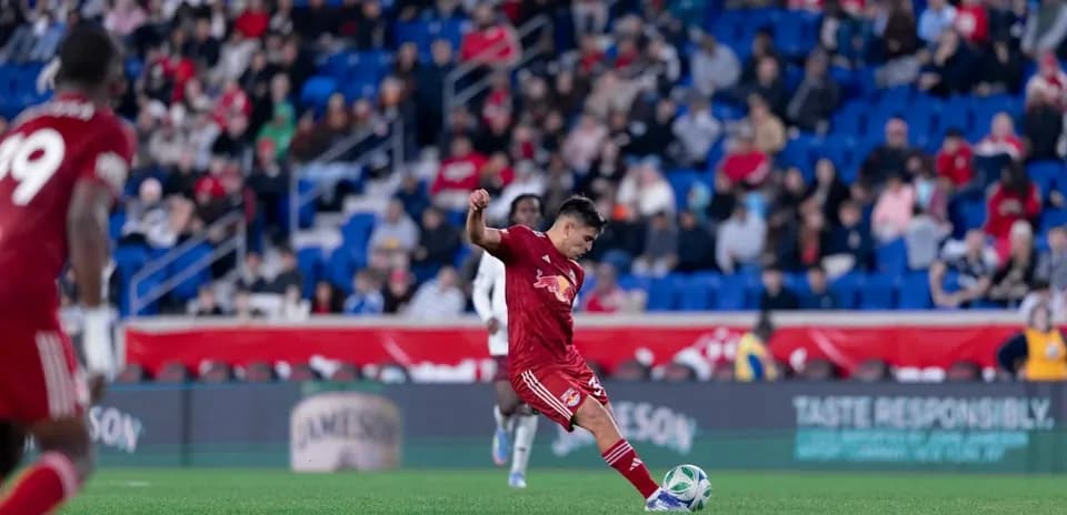 New York RB II player kicking the ball