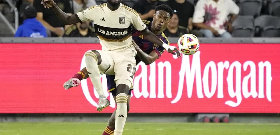 Players battling for the ball during match
