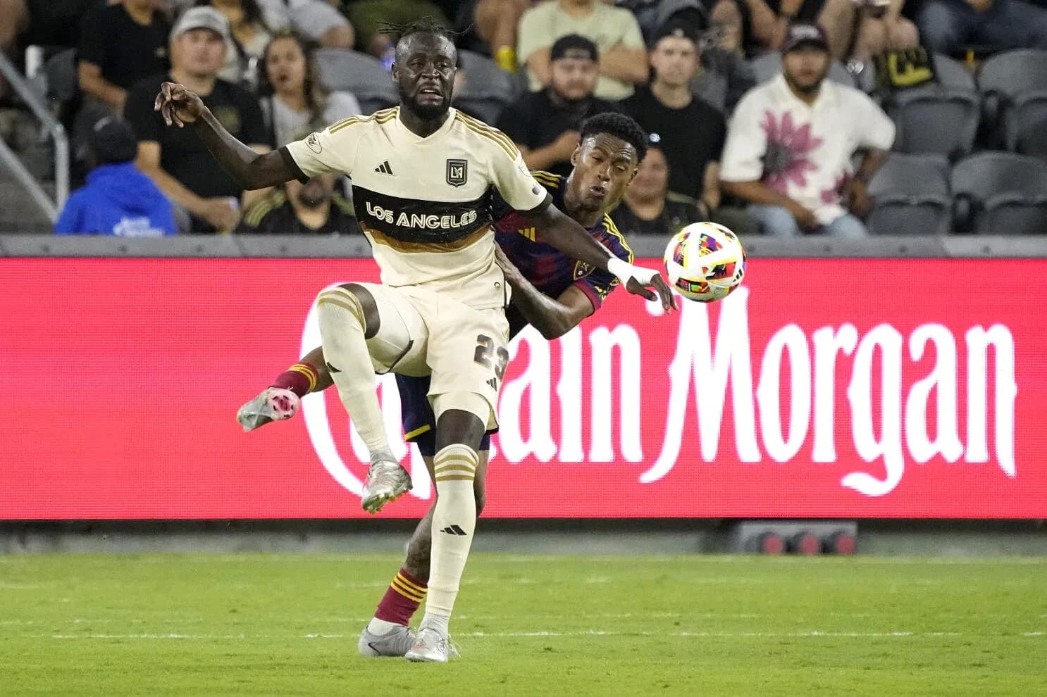 Players battling for the ball during match