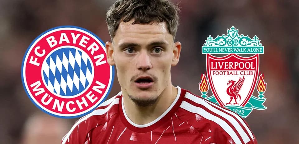 Player in Liverpool kit with club logos behind