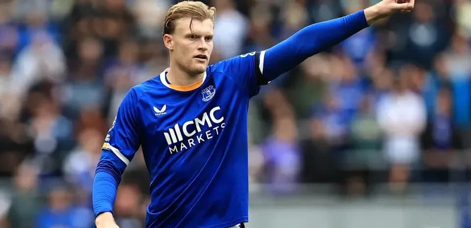 Player in blue jersey gesturing during a match