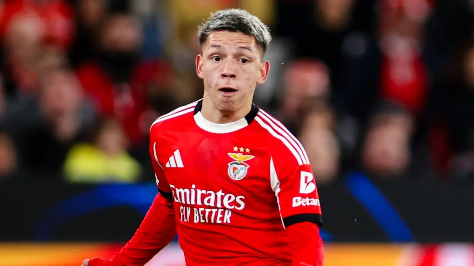 Benfica player running during match celebration