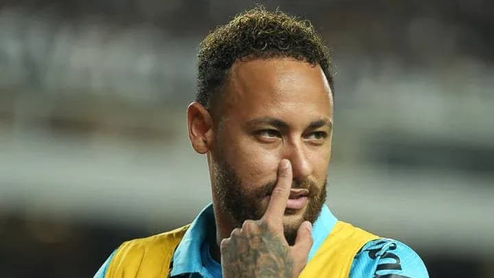 Neymar gesturing while wearing training gear