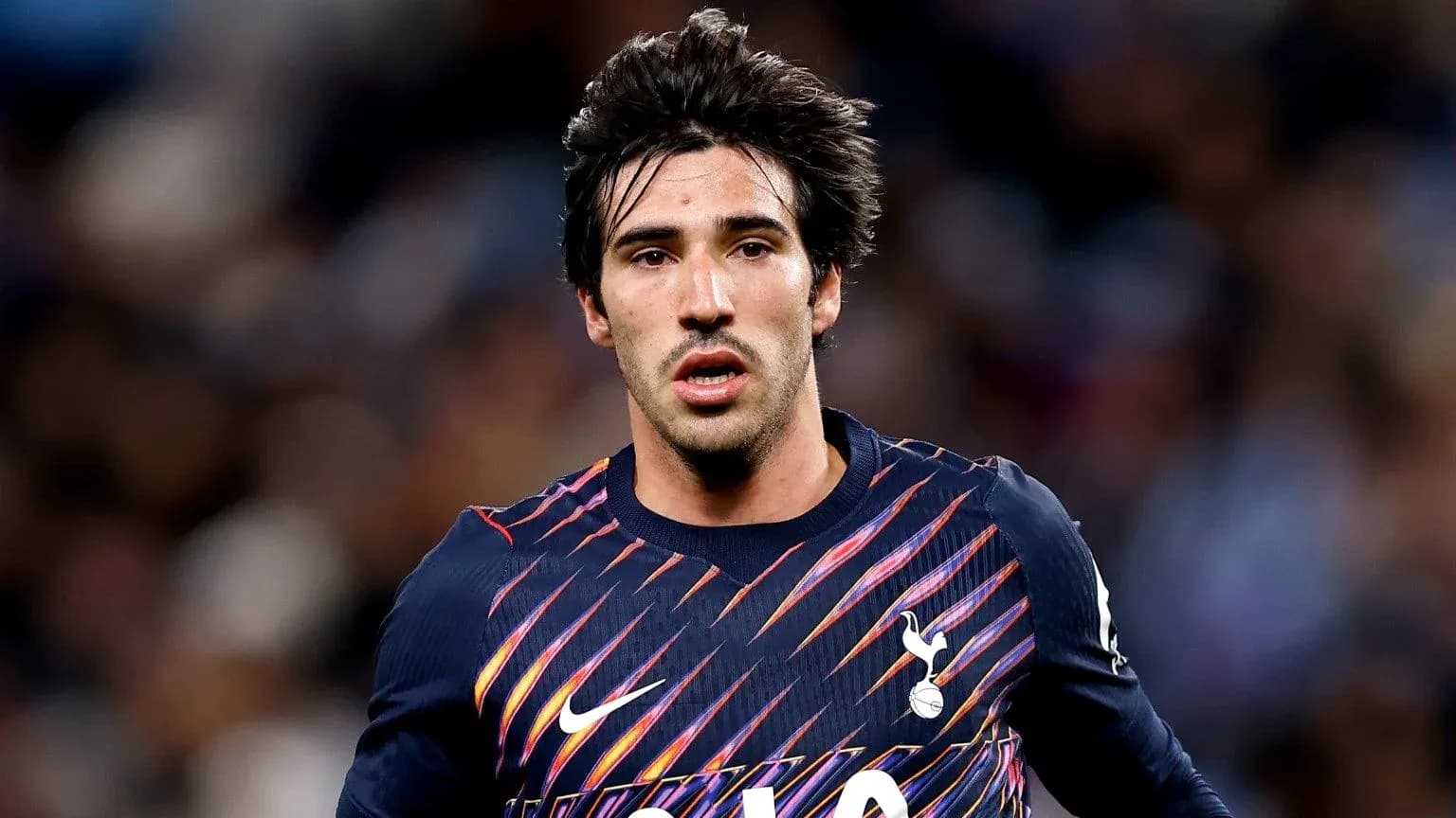 Player wearing Tottenham jersey during a match
