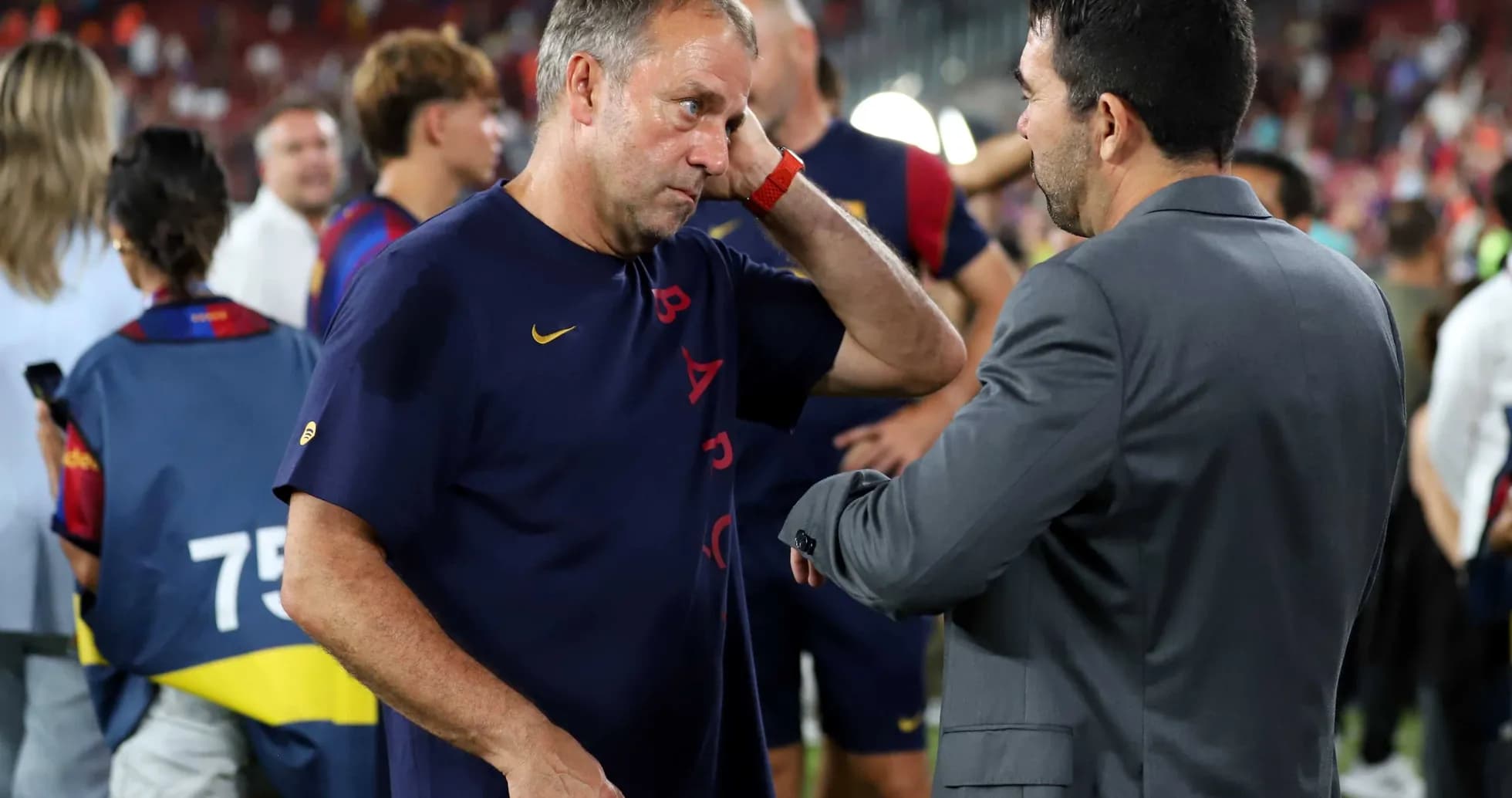 Coaches discussing on the field after match