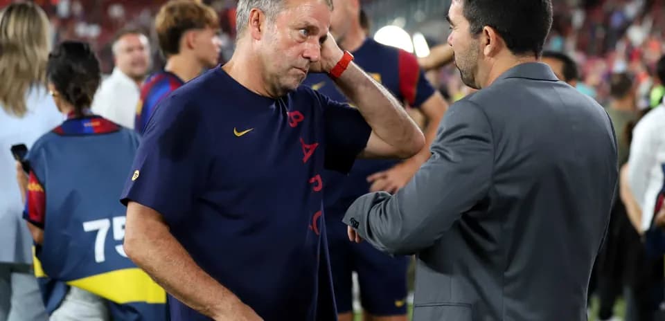 Coaches discussing on the field after match