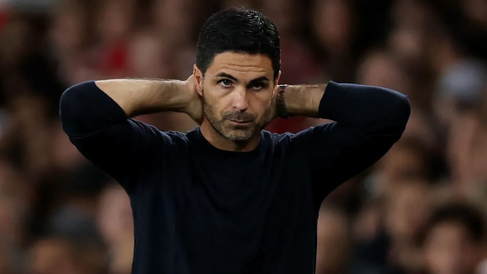Manager with hands on head during match