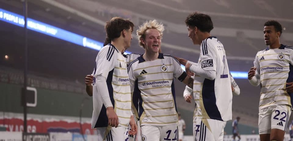 Players celebrating a goal during match