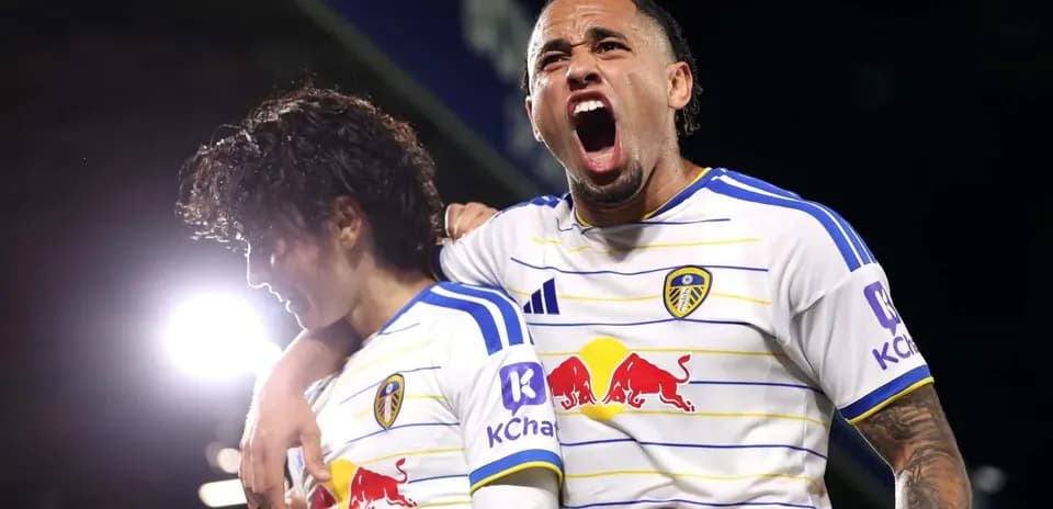 Two Leeds United players celebrating a goal