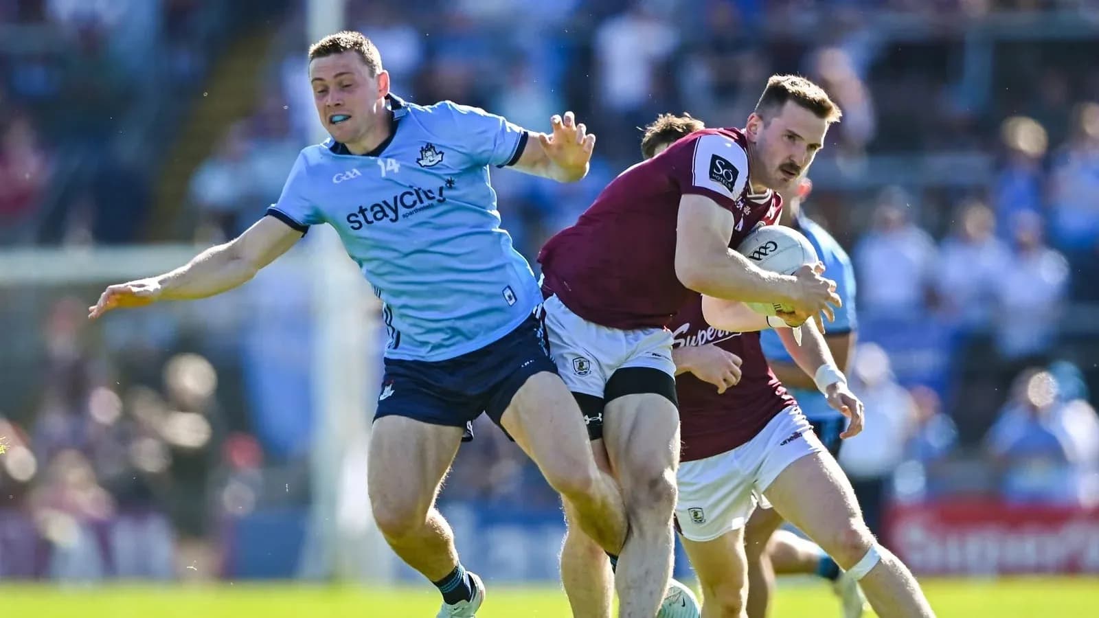 Player being tackled while carrying the ball