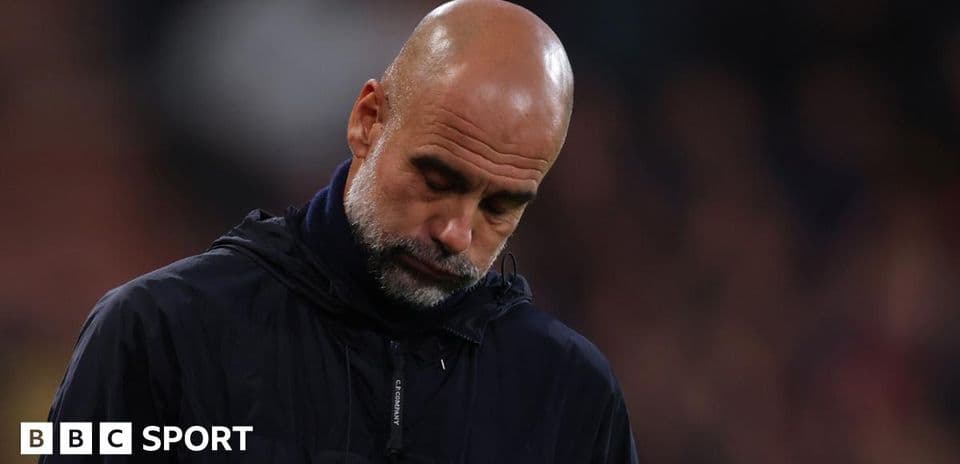 Coach looking down during match on sidelines