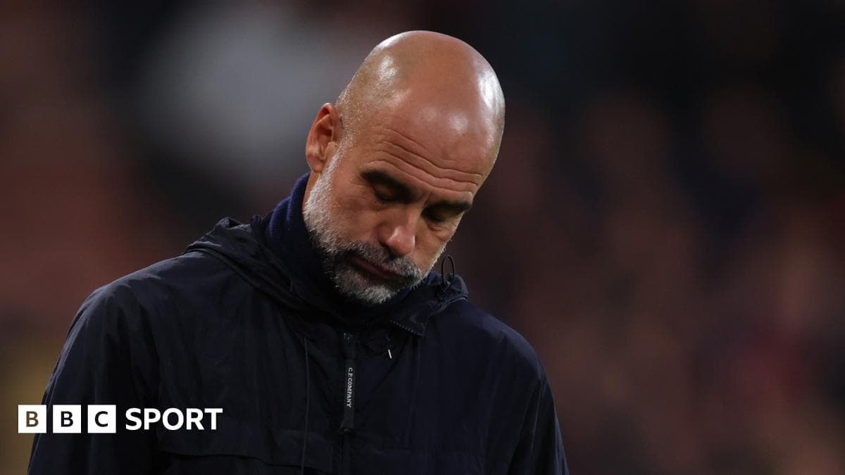 Coach looking down during match on sidelines