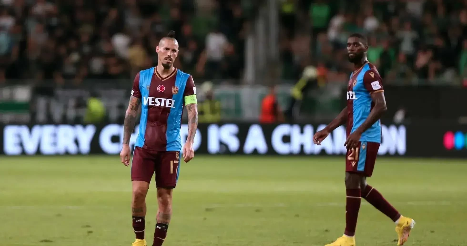 Trabzonspor players walking off the pitch