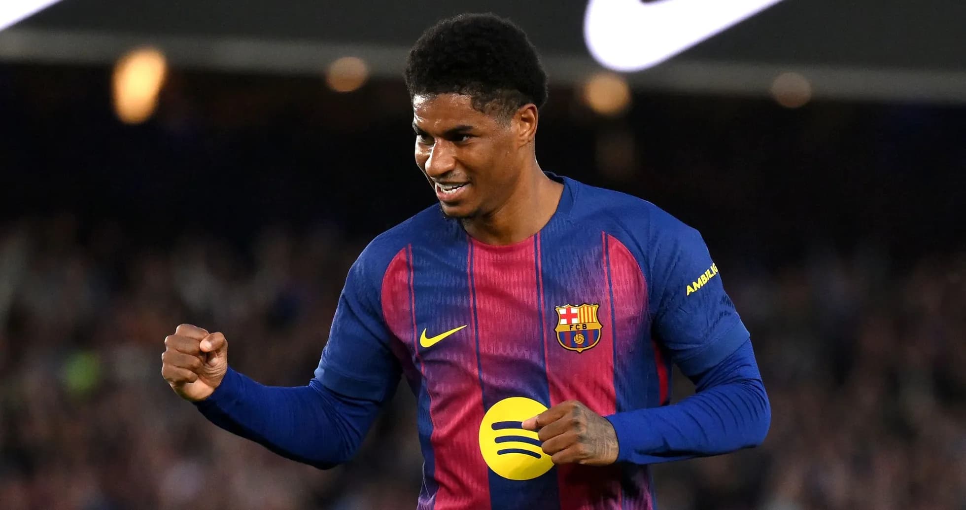 Player celebrating a goal in Barcelona kit
