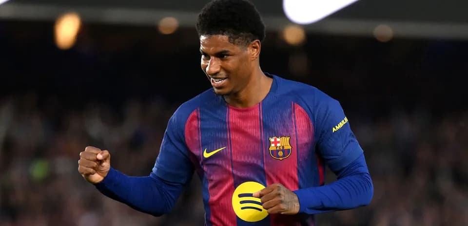 Player celebrating a goal in Barcelona kit