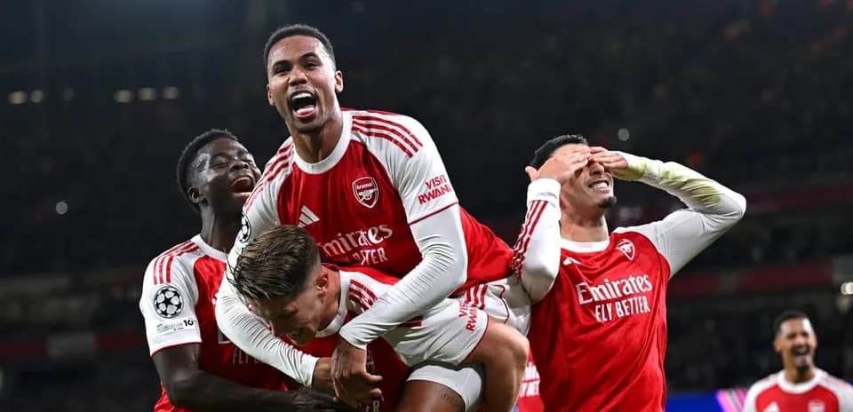 Arsenal players celebrating during UEFA Champions League match