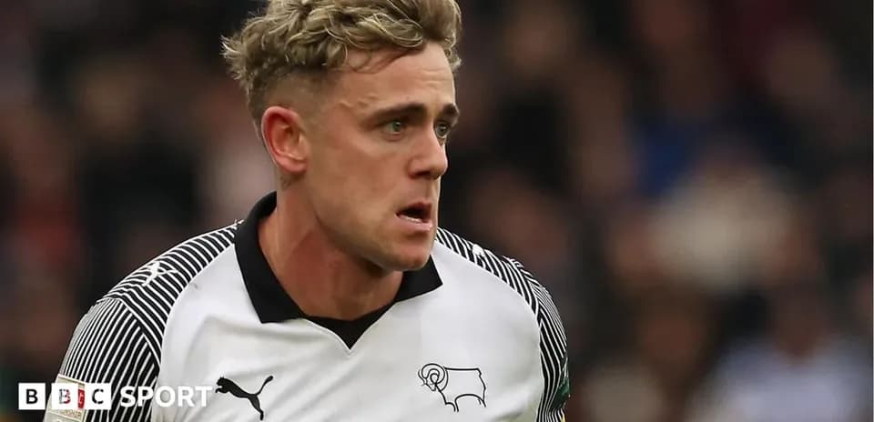Player in Derby County kit running during match