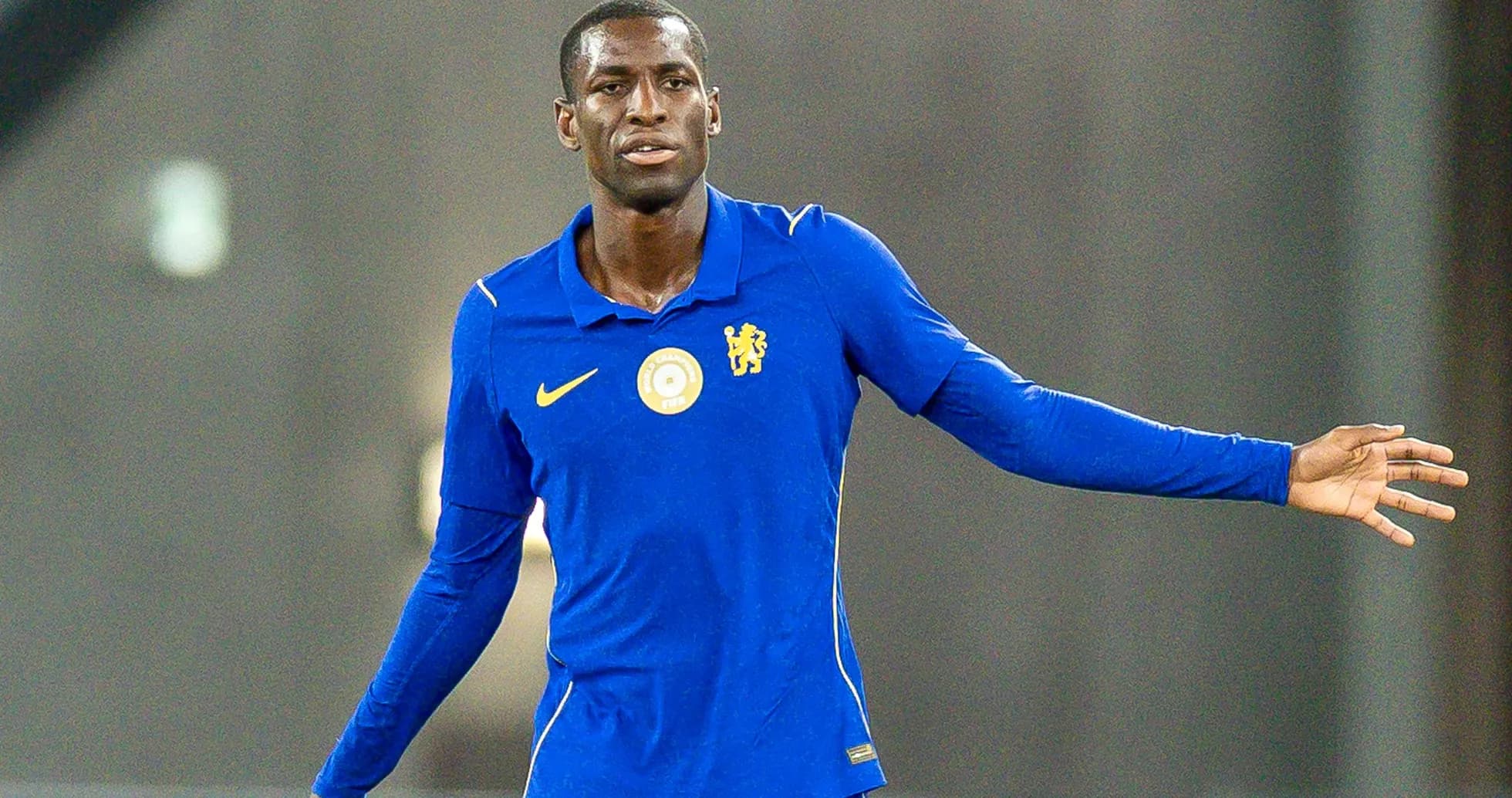 Player in blue kit gesturing during practice session