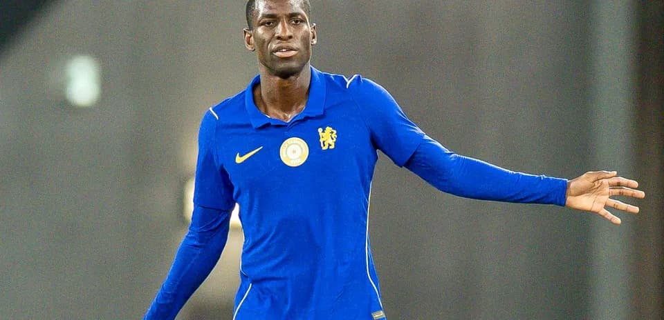 Player in blue kit gesturing during practice session