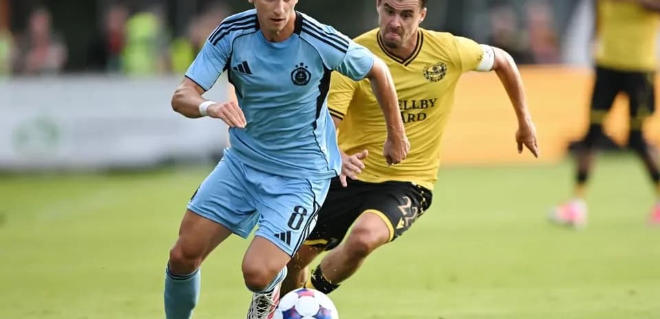 Player dribbling the ball during football match