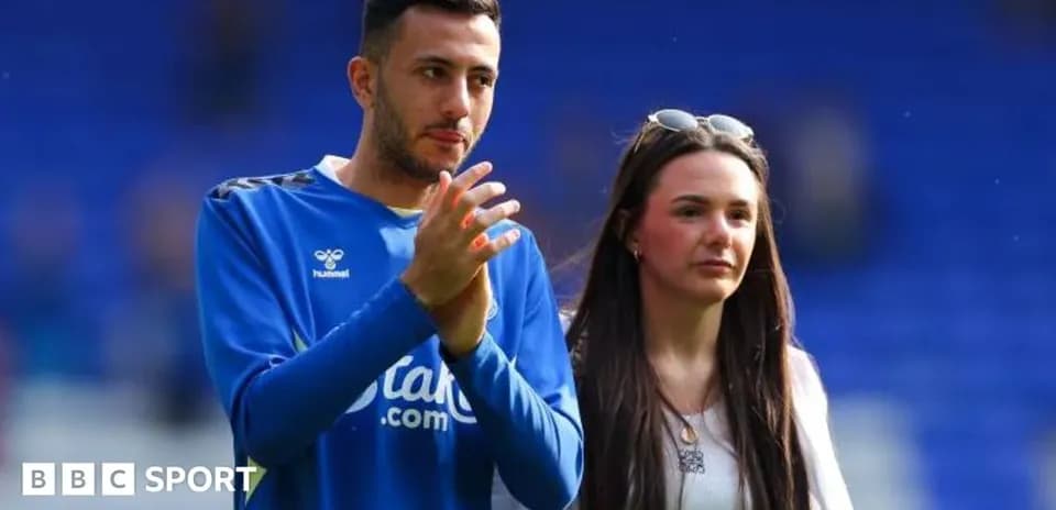 Player and companion walking on the pitch
