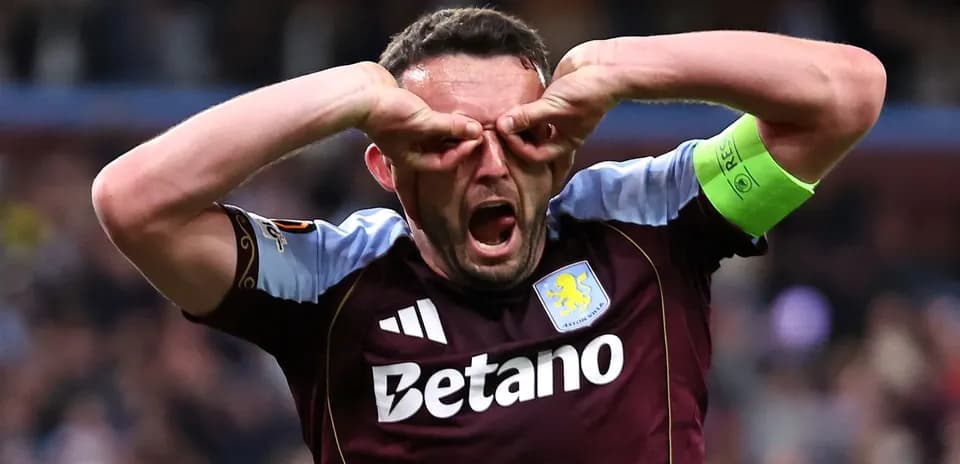 Aston Villa player celebrating with hands on face
