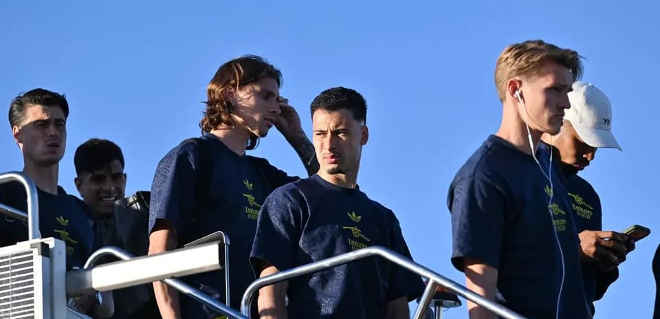 Players descending stairs in team training gear