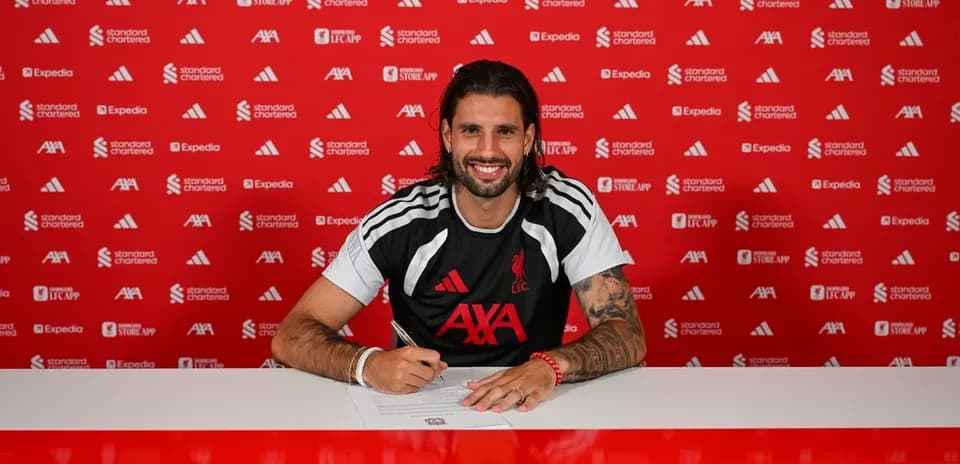 Player signing contract at Liverpool FC press event