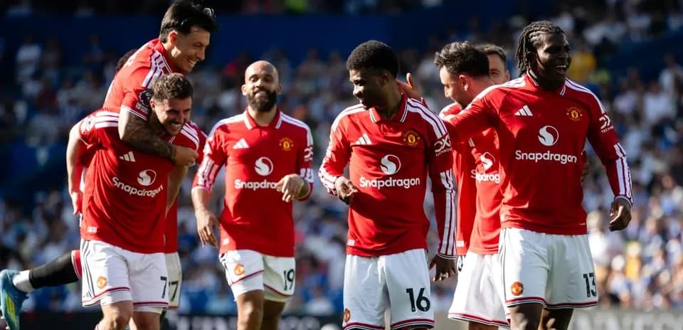 Manchester United players celebrating a goal together