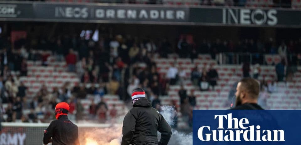 Fans with flares in stadium during match