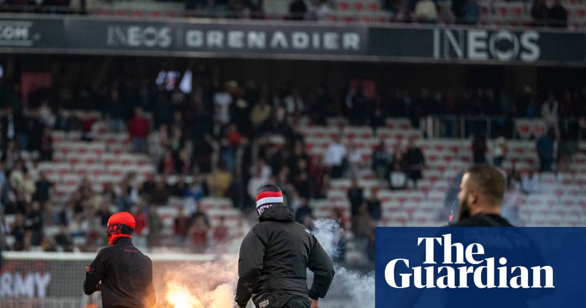 Fans with flares in stadium during match