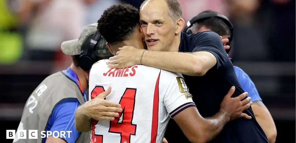 Player embracing coach after match celebration