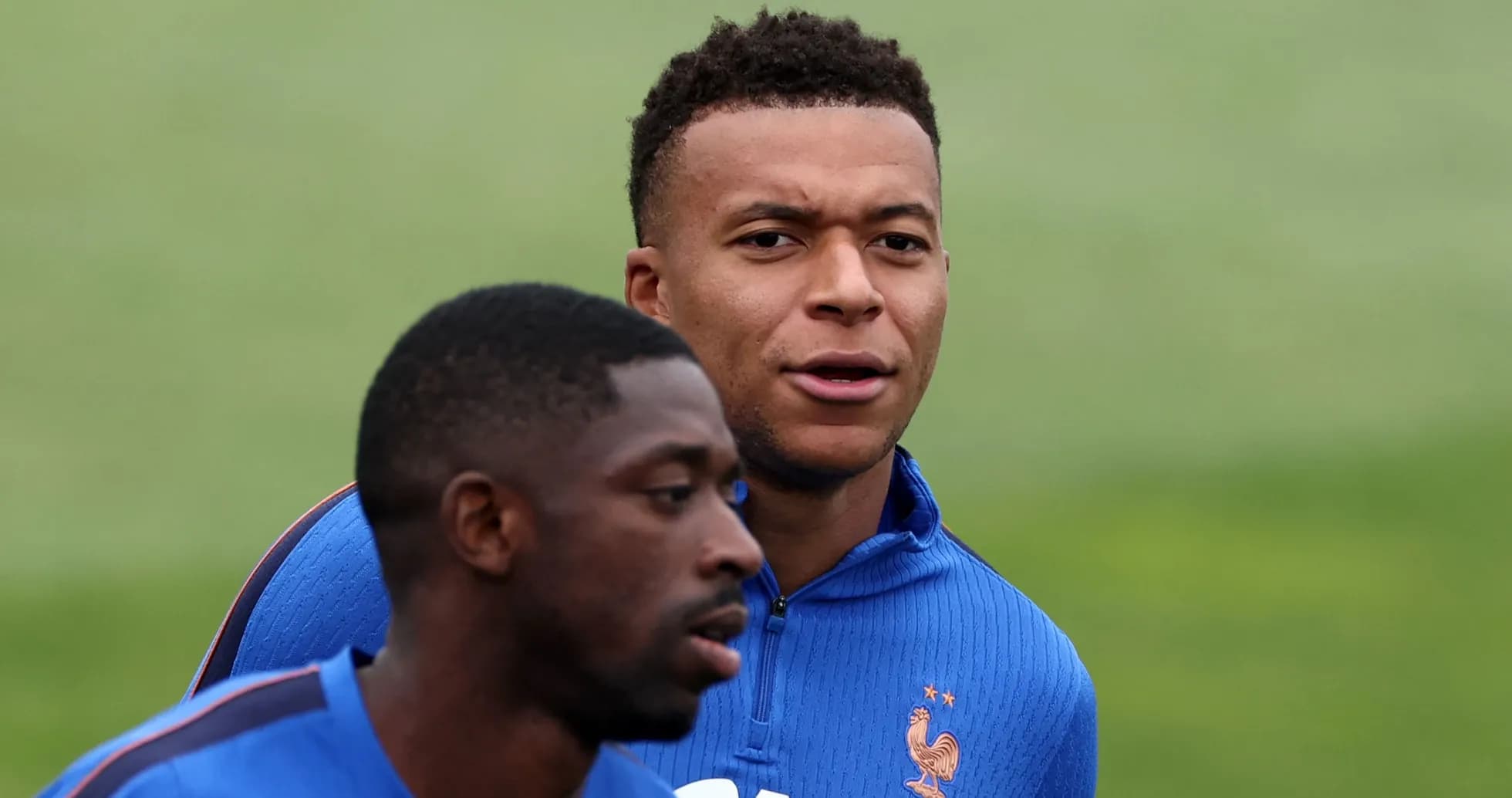 Two players training in blue jerseys during practice