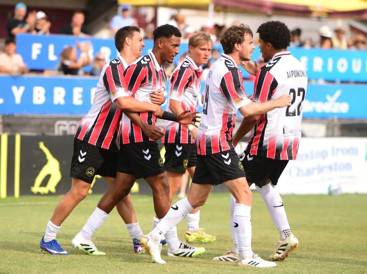 Players celebrating a goal during USL Championship match