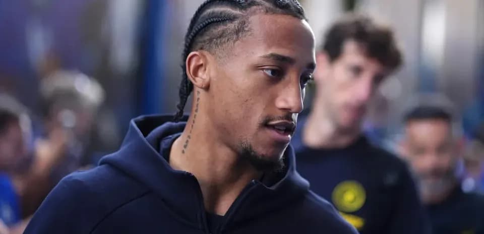 Player with braids walking through a crowd