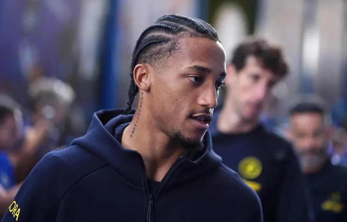 Player with braids walking through a crowd