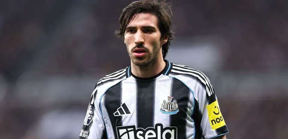 Newcastle player in black and white striped jersey