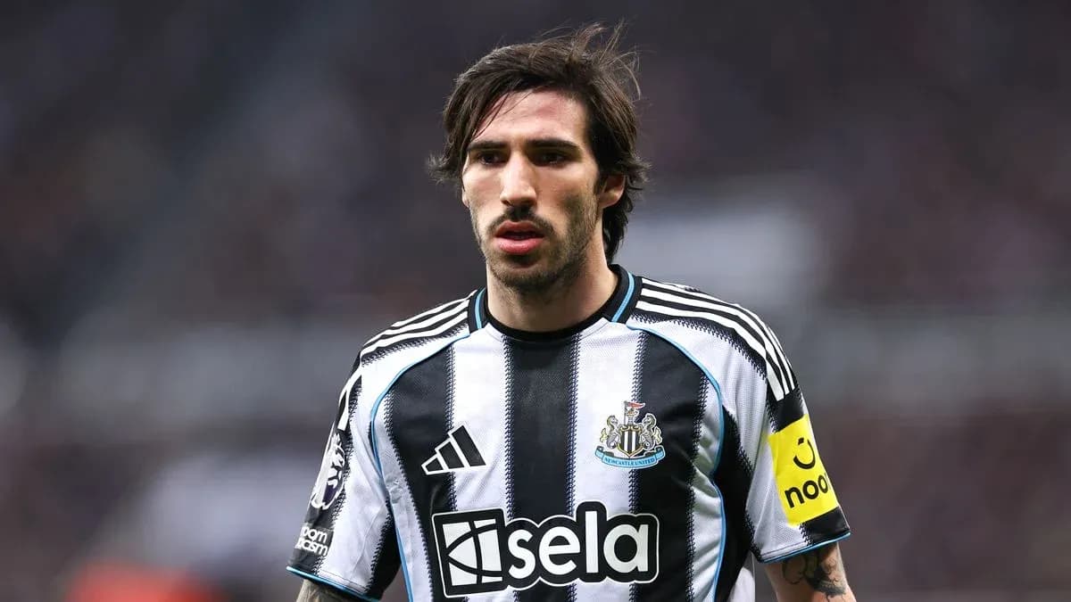 Newcastle player in black and white striped jersey