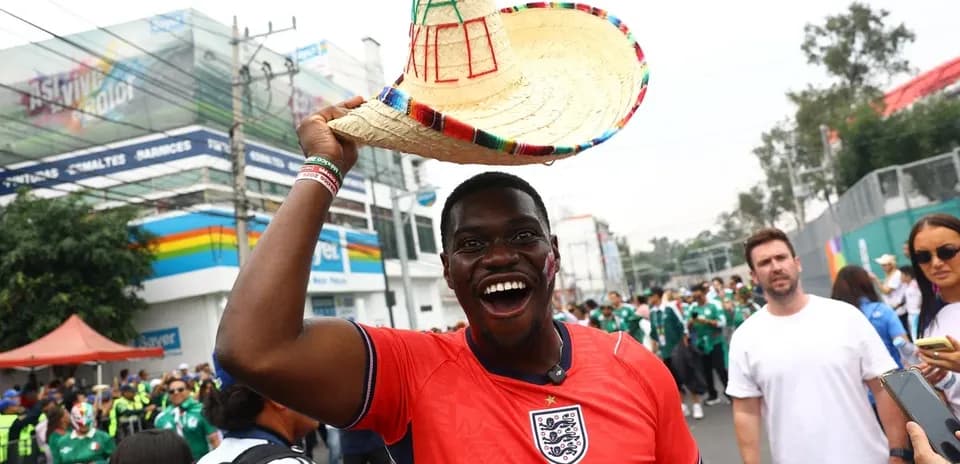 Fan in England jersey celebrating with sombrero