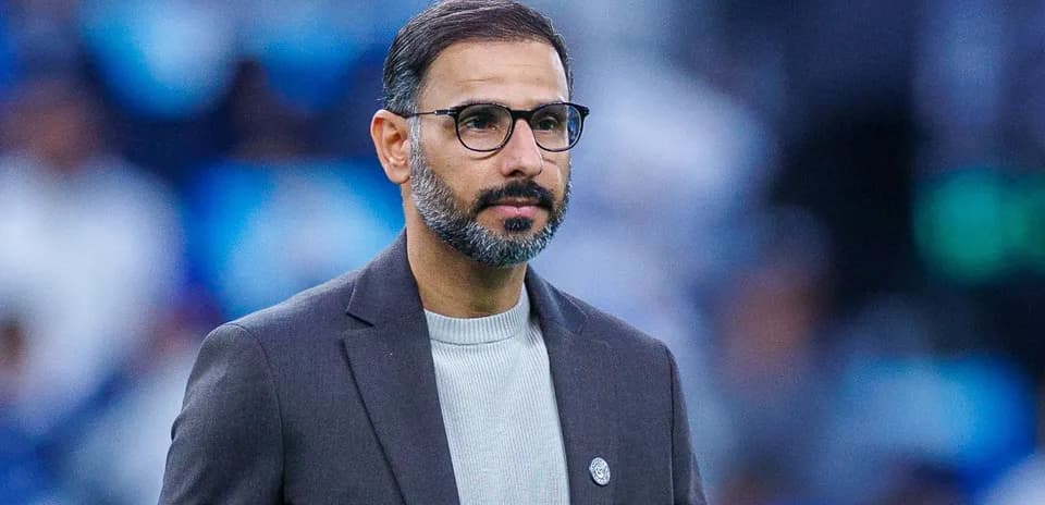 Coach observing the match from the sidelines