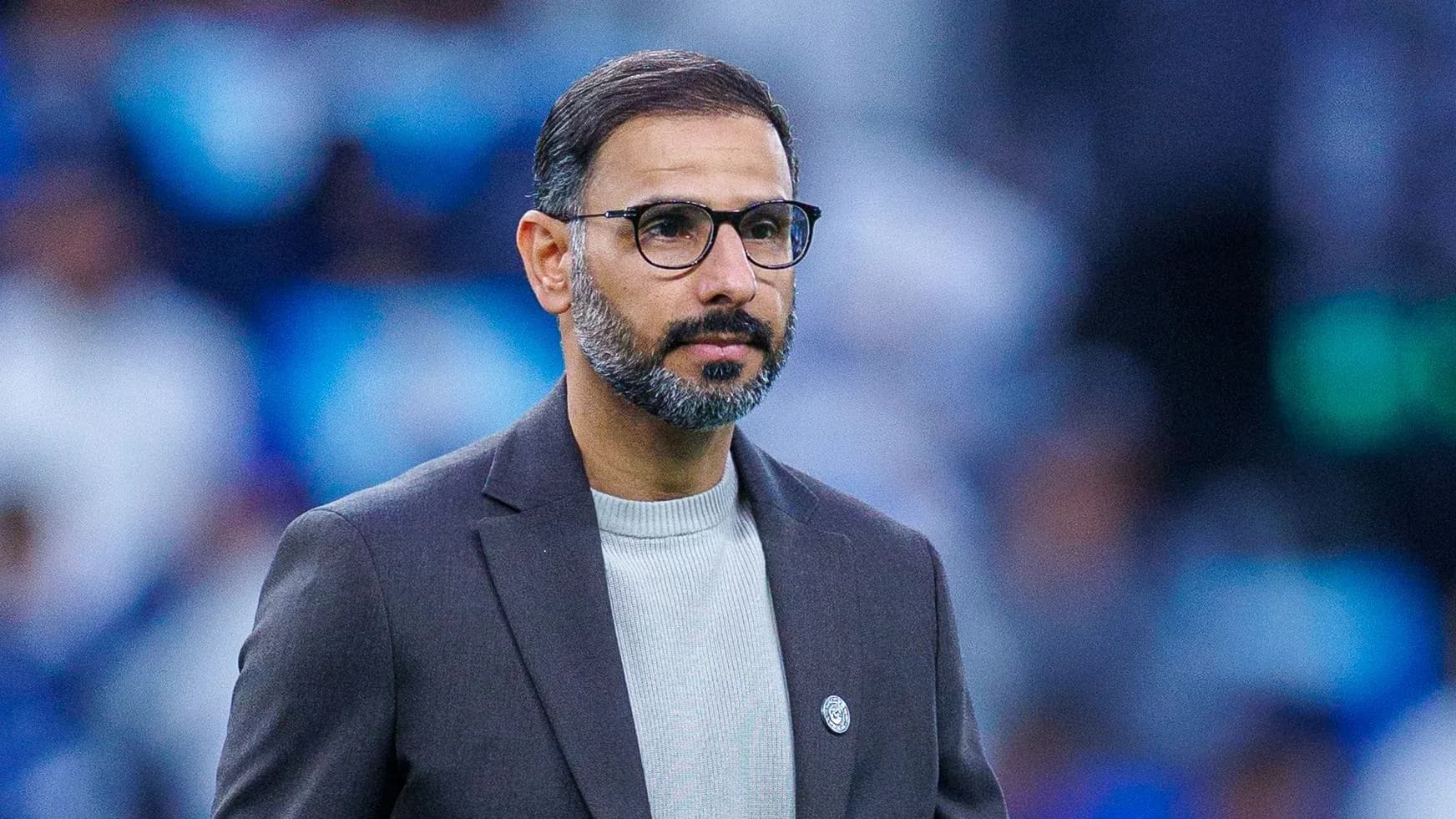 Coach observing the match from the sidelines