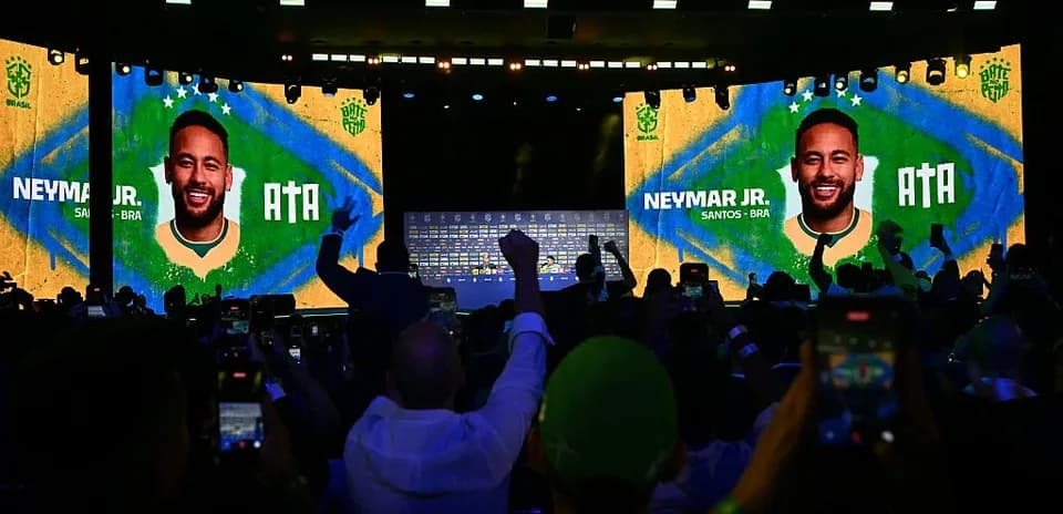 Neymar Jr. on stage at event with crowd