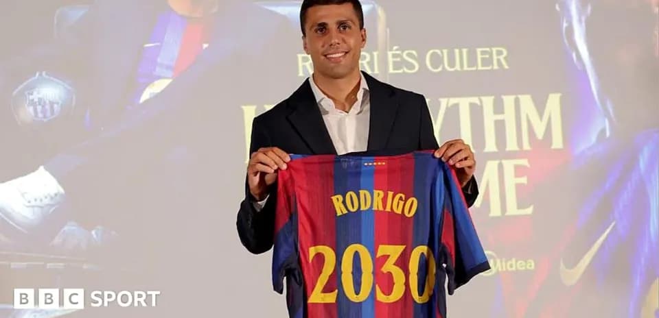 Player presenting Barcelona jersey with name Rodrigo