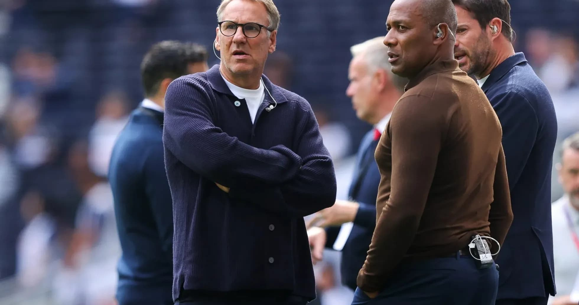 Coaches discussing strategy on the sidelines