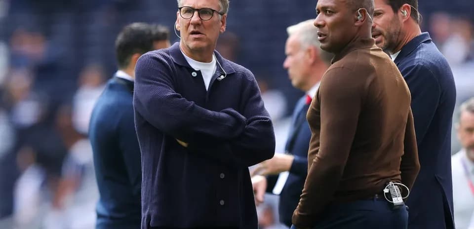 Coaches discussing strategy on the sidelines