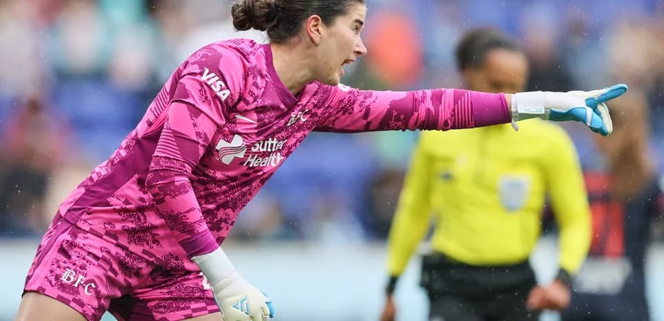 Goalkeeper directing play during NWSL match