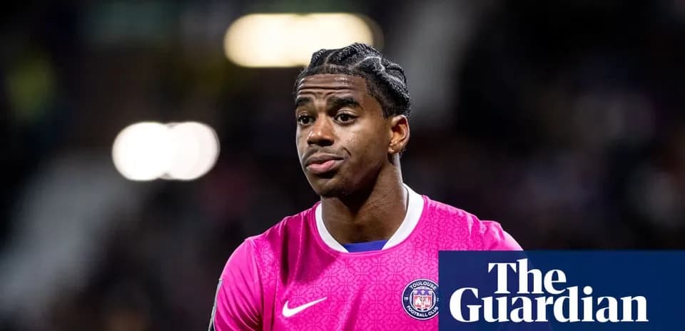 Goalkeeper wearing pink jersey during match warm-up