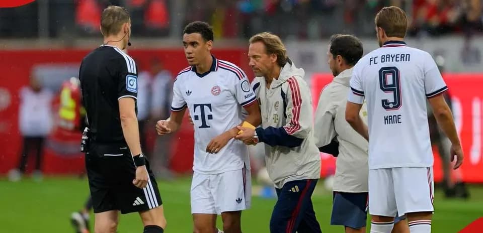 Bayern Munich players discussing with referee during match