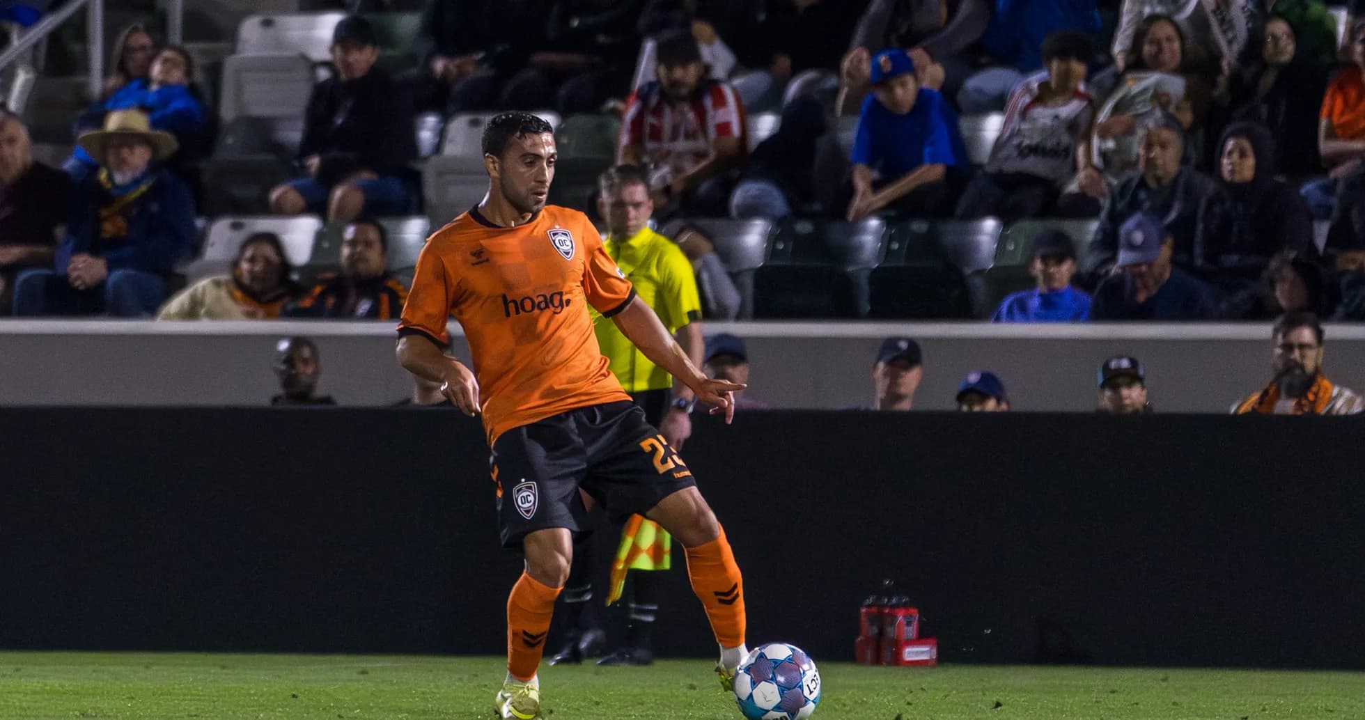 Player from Orange County SC dribbling ball
