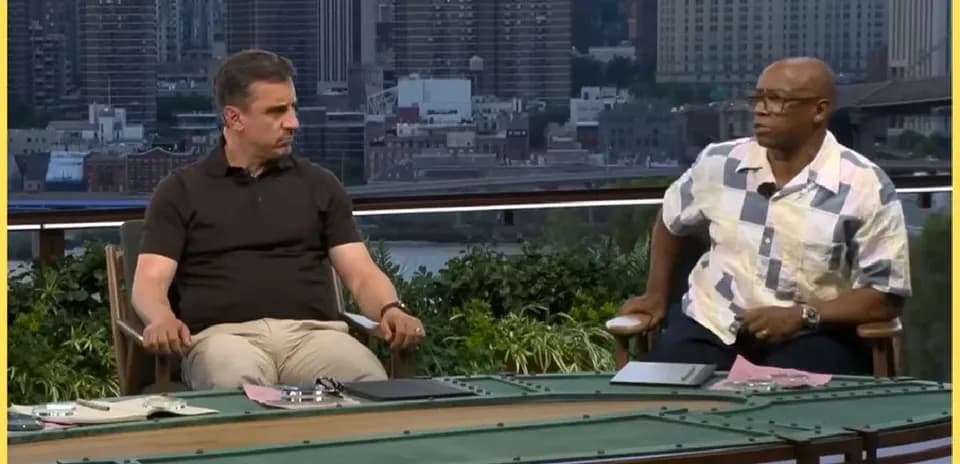 Two analysts seated at a discussion table outdoors
